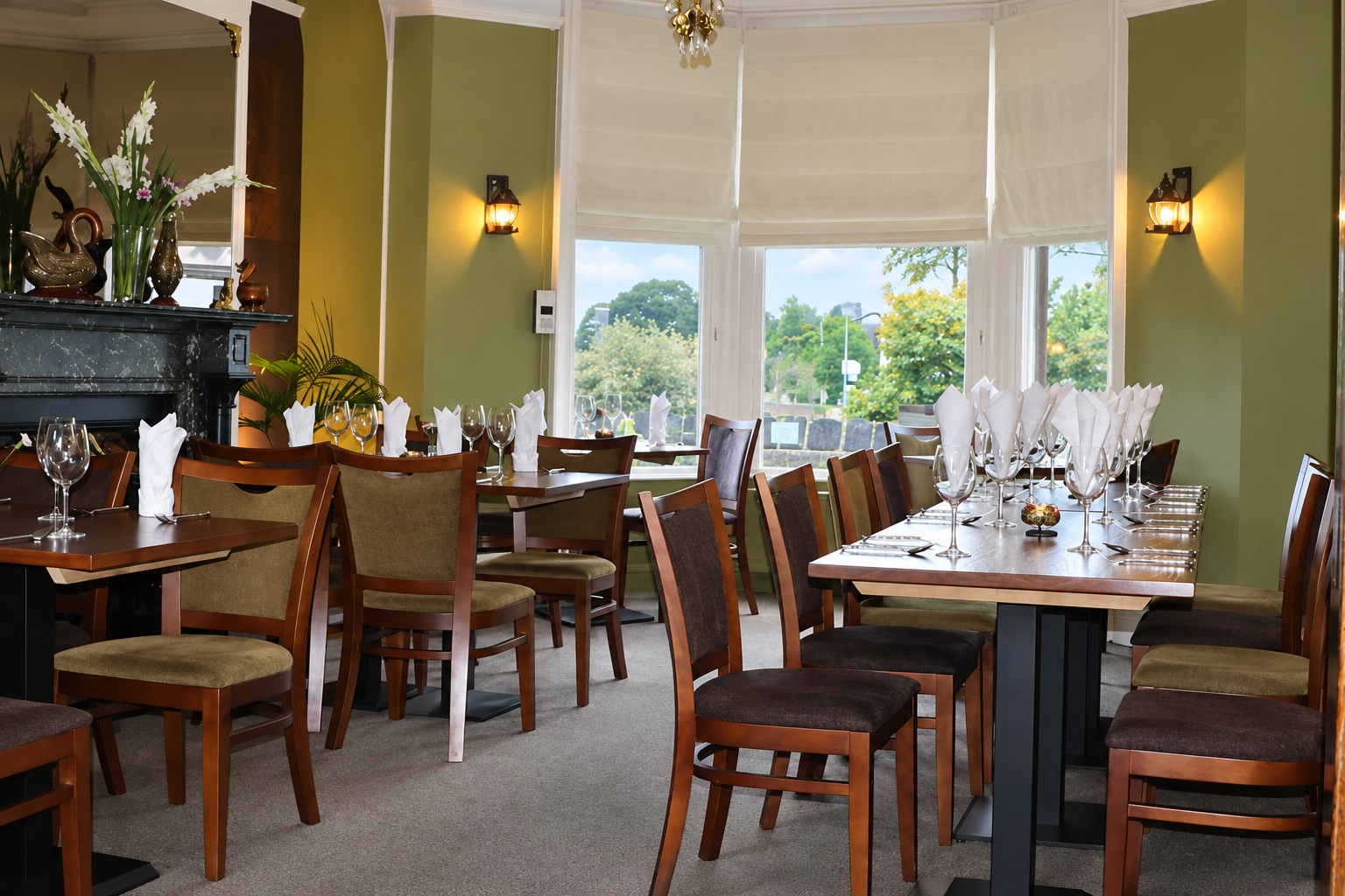 Warm, intimate Thai restaurant dining room with candlelit tables